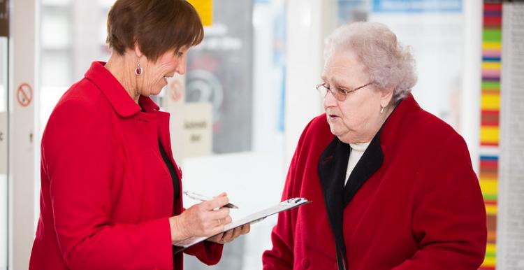 Two women speaking to one another