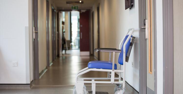 Patient Wheelchair in Hospital Corridor