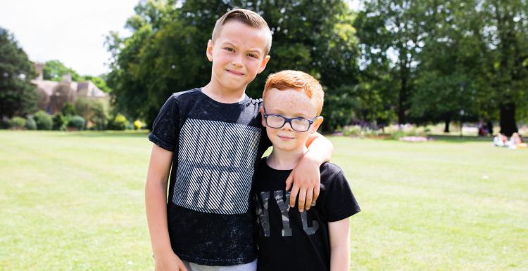 Two young boys on the grass