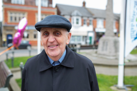 Elderly white male with a hat on. 